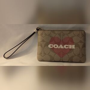 Coach zip top wristlet.